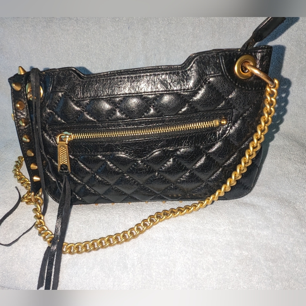 Rebecca Minkoff black quilted leather bag with gold studds.